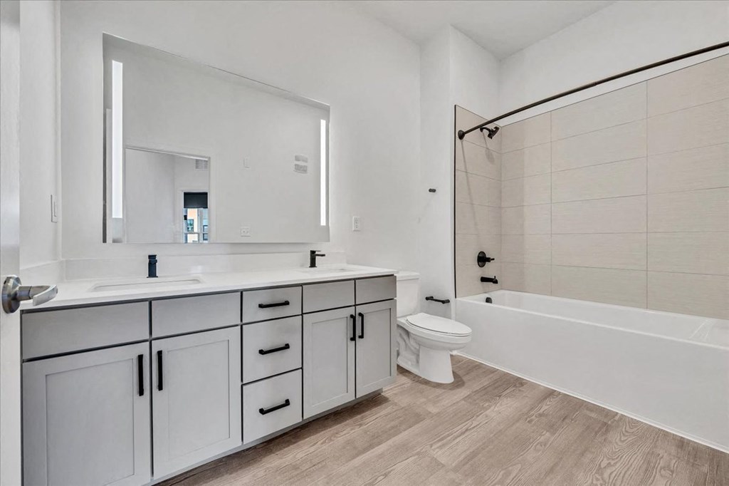 a bathroom with a sink toilet and a bath tub at Luxe 360 in Midlothian, Virginia, 23114