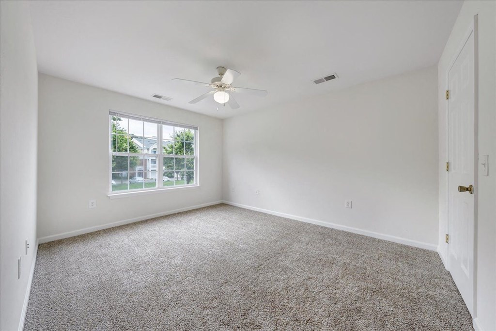 Spacious Carpeted Bedroom with Large Window  at Enclave Apartments, Midlothian, VA