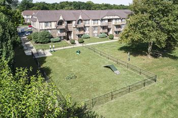 an aerial view of the backyard of an apartment complex at The Timbers Apartments, Evansville, Indiana