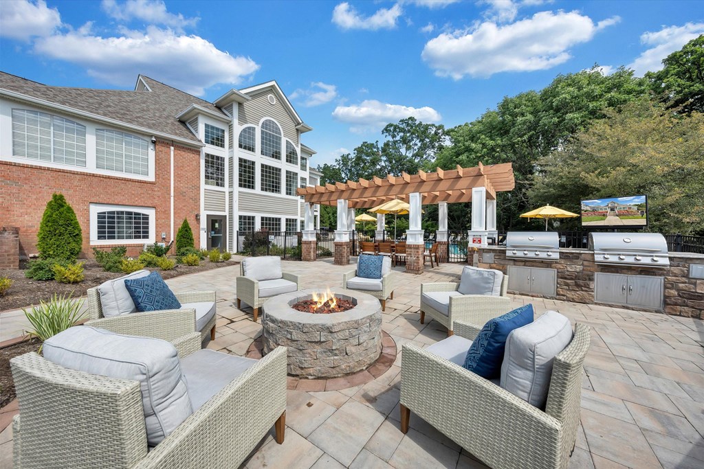 the estates at tanglewood|furnished patio with fire pit and seating area at Sunscape Apartments, Roanoke, Virginia