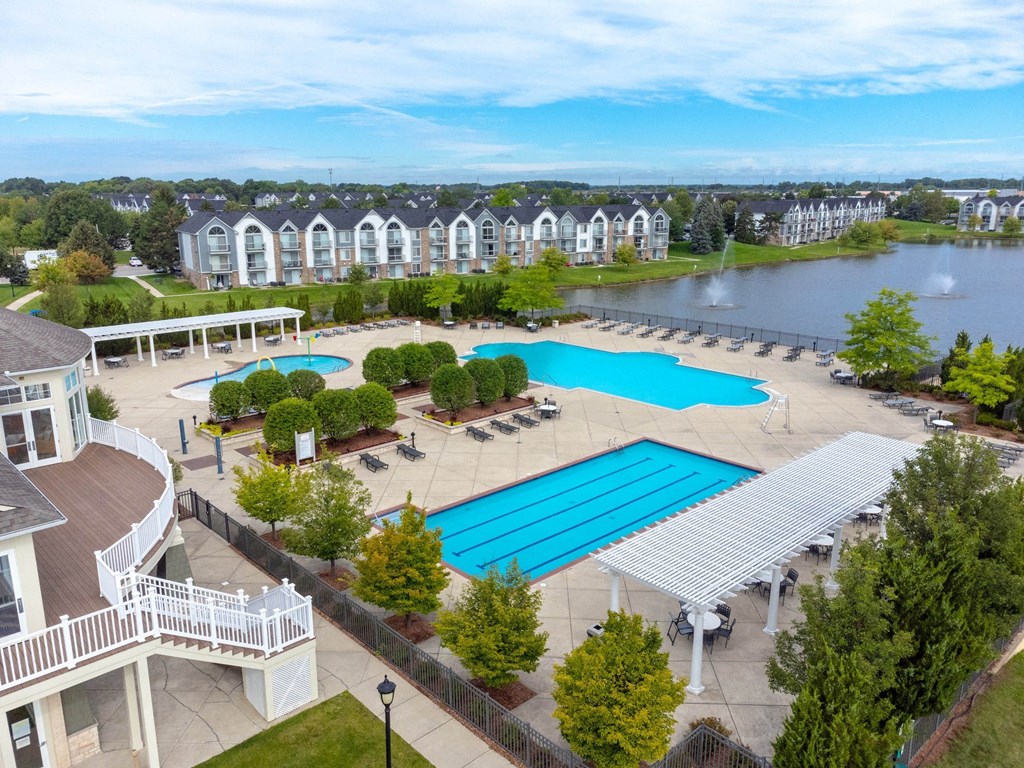 an aerial view of the resort style pool and hot tub at The Harbours Apartments, Clinton Twp, MI