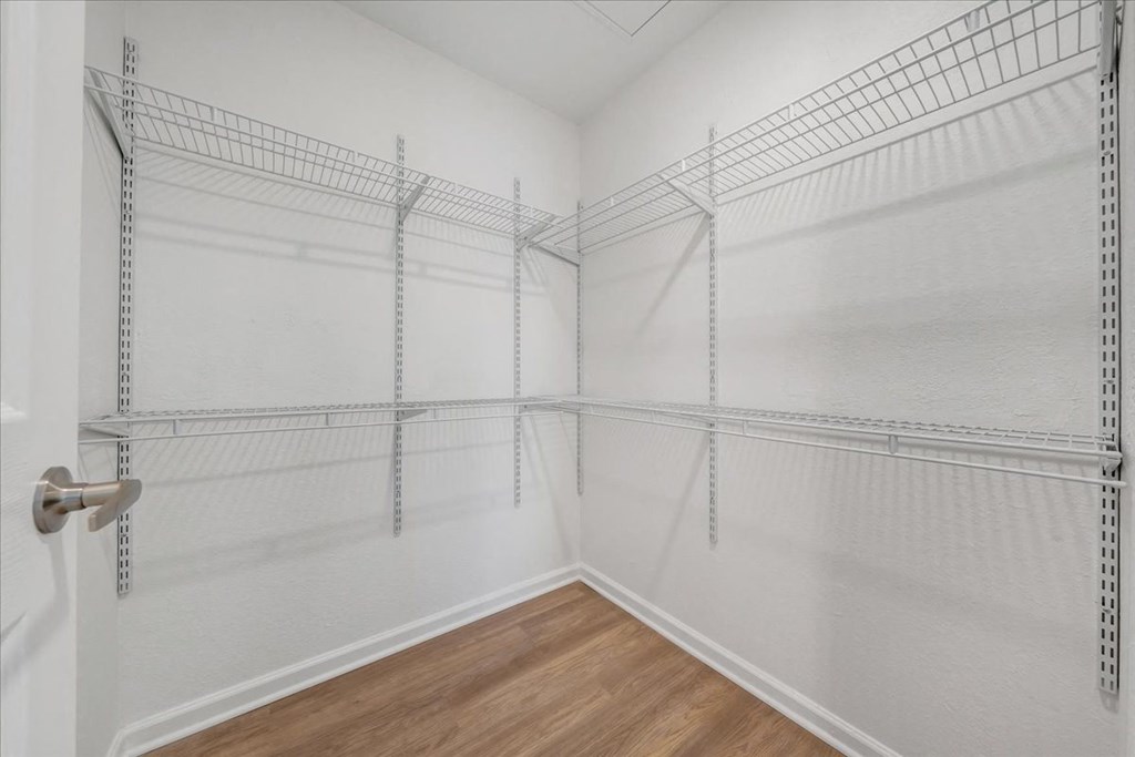 a room filled with empty shelves in a closet at The Vinings Apartments, Richmond, Virginia