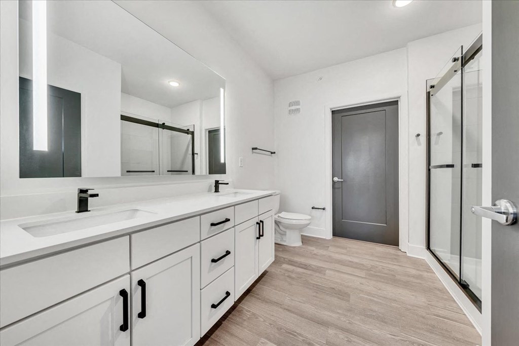a bathroom with a sink and a toilet and a shower at Luxe 360 in Midlothian, Midlothian Virginia