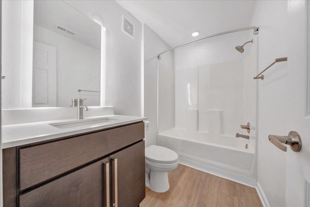 a bathroom with a sink toilet and a shower at The Vinings Apartments, Richmond