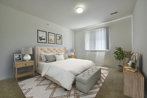 a white bedroom with a large bed and a couch