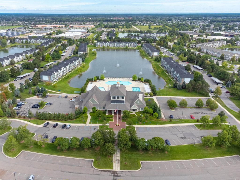 a mansion with a lake in the middle of itat The Harbours Apartments, Michigan