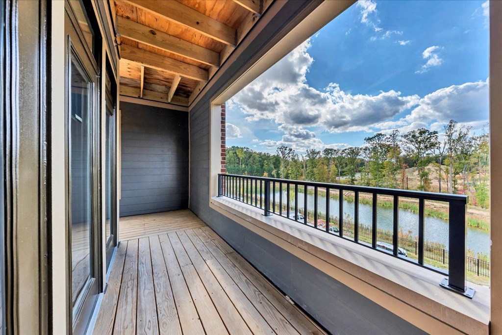 a balcony with a view of a body of water at Luxe 360 on Centerpointe Apartments, Midlothian, Virginia