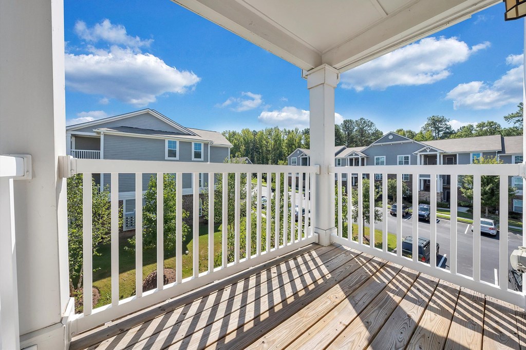 the view from the balcony of a home with a wooden deck  at Avellan Springs Apartments, North Carolina