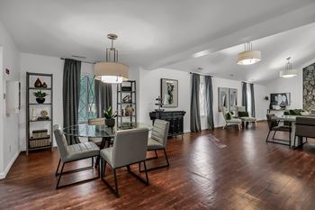 a living room and dining room with a table and chairs at Polo Run Apartments, Greenwood, Indiana