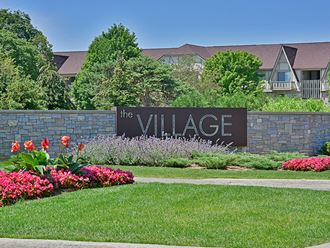 Entrance Sign and Garden at The Village Apartments, Wixom, MI