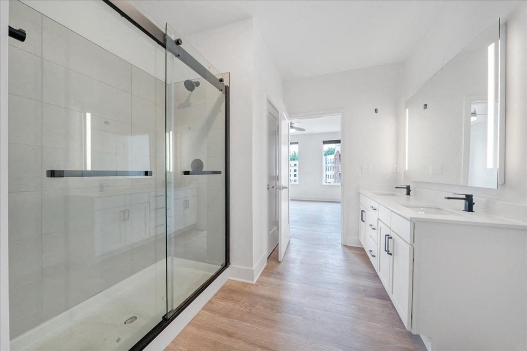 a bathroom with a glass shower stall at Luxe 360 in Midlothian, Midlothian, VA 23114
