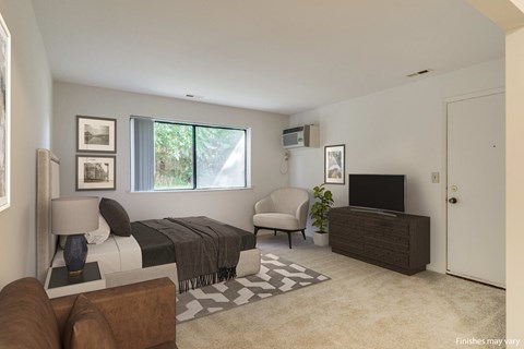 A living room with a brown couch, a bed, a chair, a television, and a potted plant.