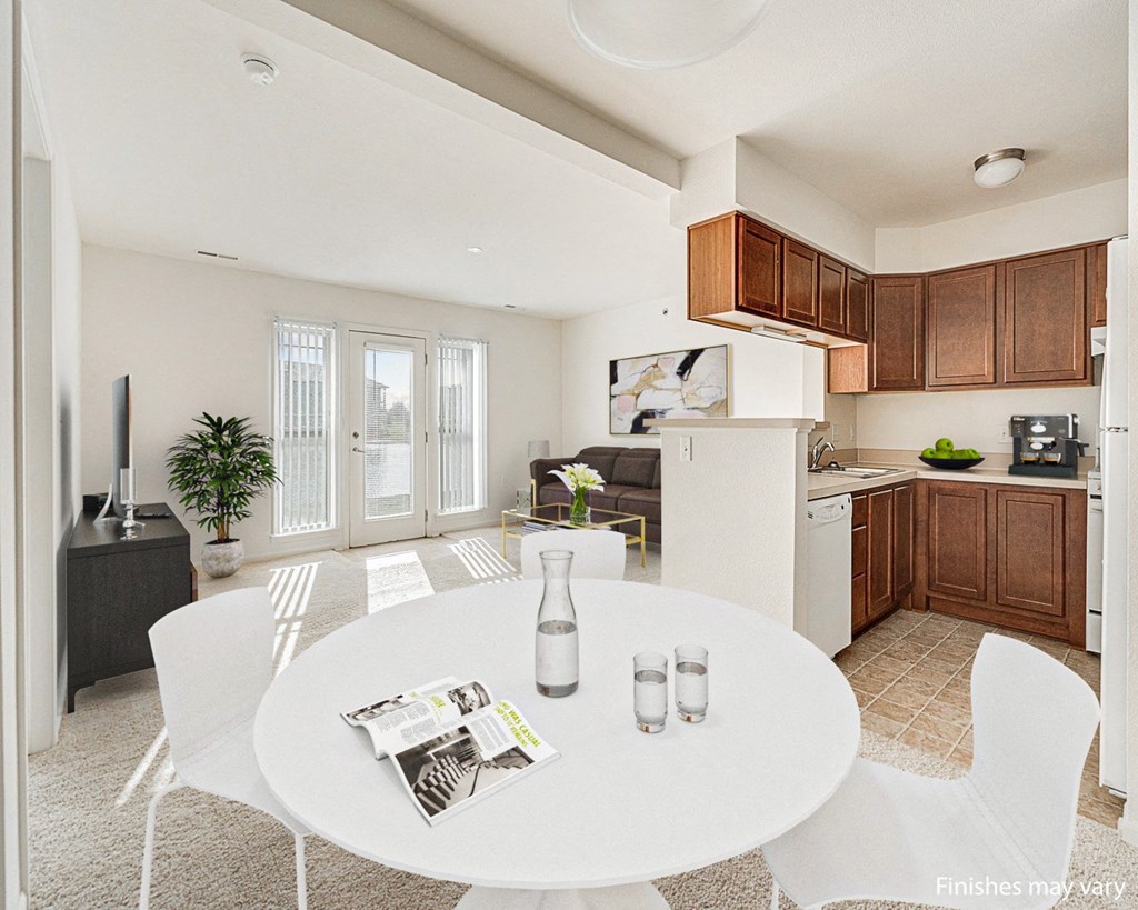 Buttercup Layout Model Dining Space with Kitchen View at The Harbours Apartments, Clinton Twp, MI 48038