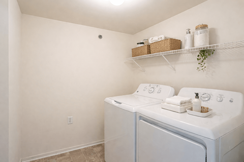 A laundry room with a washer and dryer.