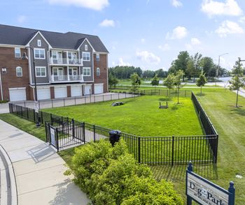 A large building with a sign that says D&P Apartments.