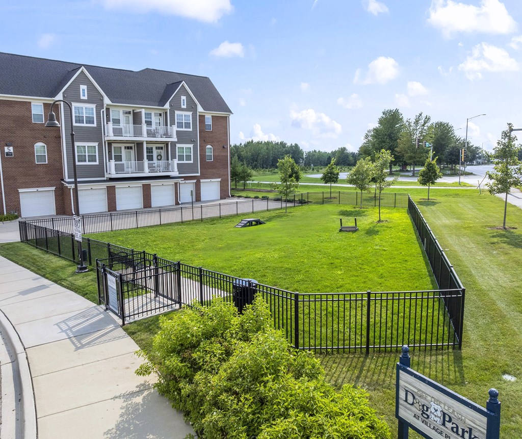 A large building with a sign that says D&P Apartments.