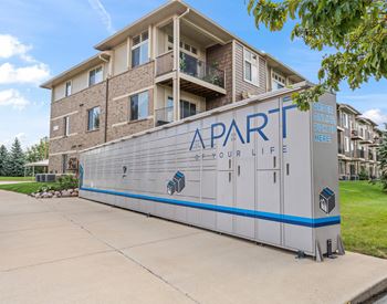 Apartment building with a package locker in front
