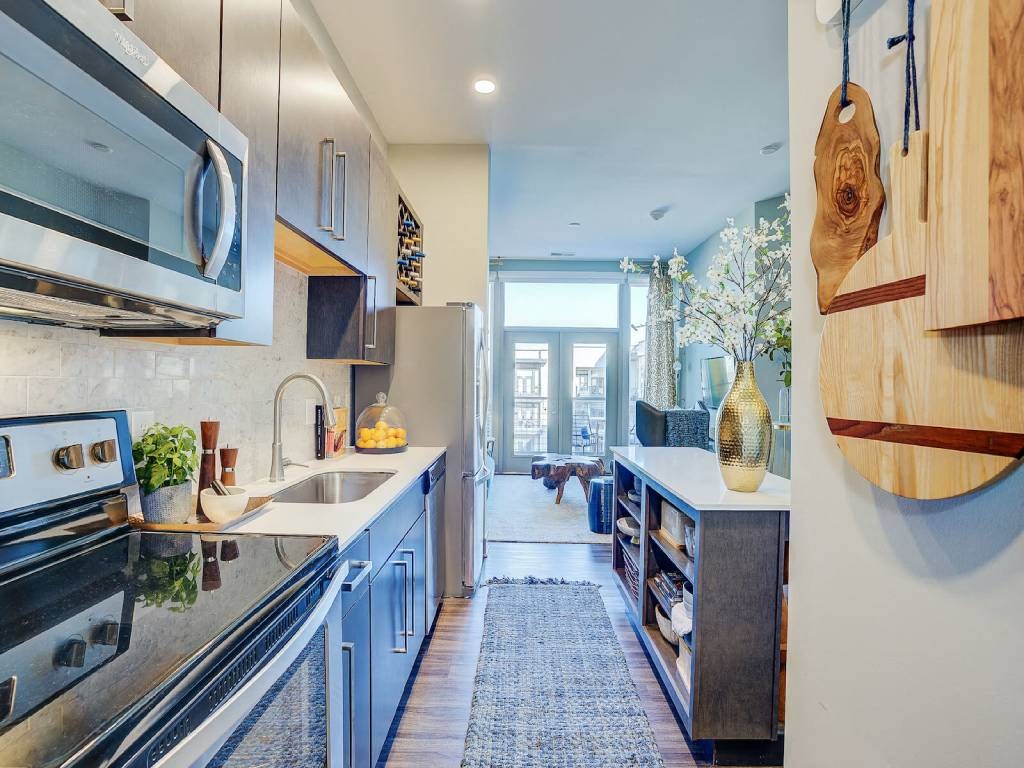 a kitchen with a sink and a microwave  at Avant & Avant II, Carmel, IN, 46032