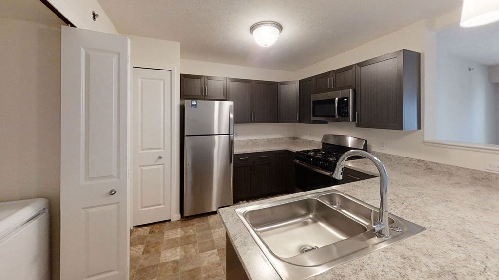 Kitchen with Stainless Steel Appliances Offered at Andover Pointe Apartment Homes, La Vista, 68138