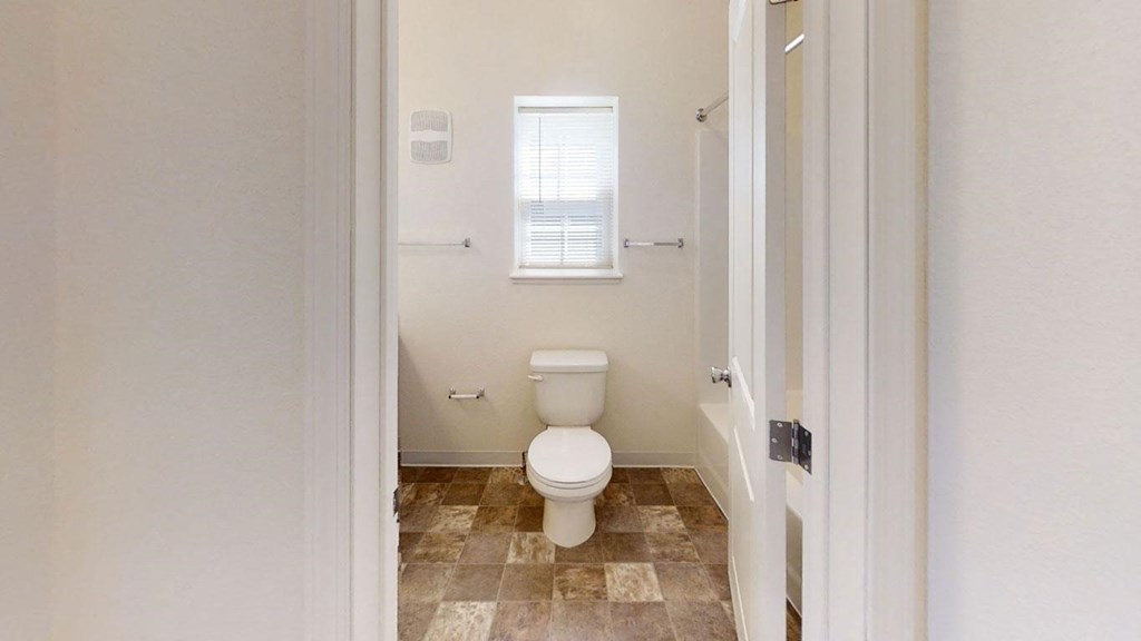 an end style bathroom with a window