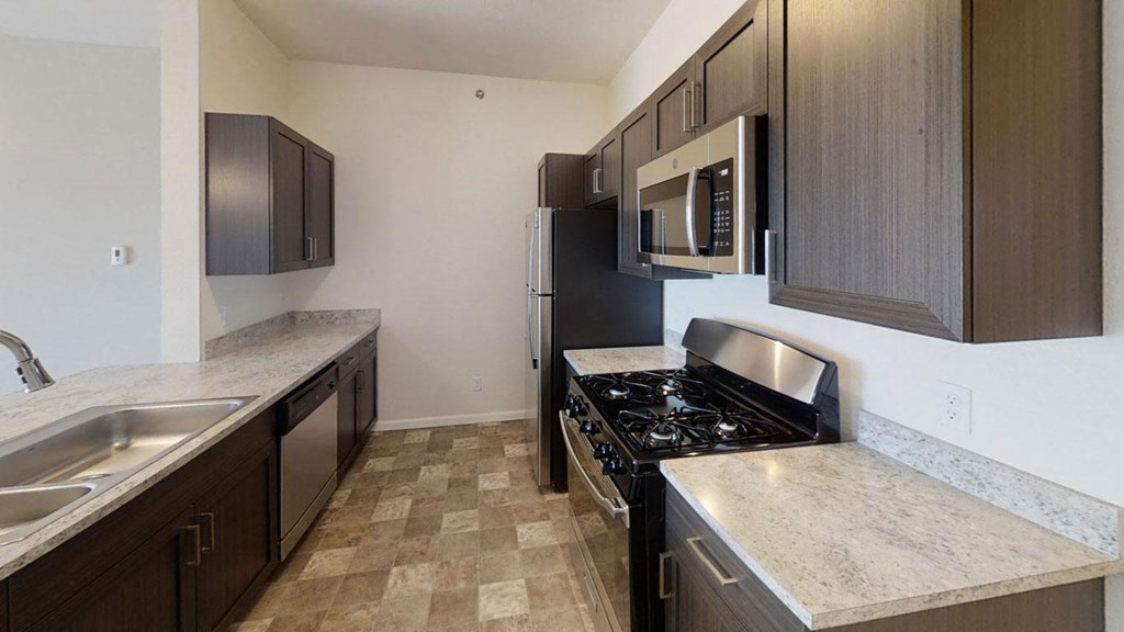 a two bedroom kitchen with stainless steel appliances at Andover Pointe Apartment Homes, La Vista, 68138