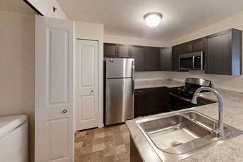 Kitchen with Stainless Steel Appliances Offered at Andover Pointe Apartment Homes, La Vista, 68138