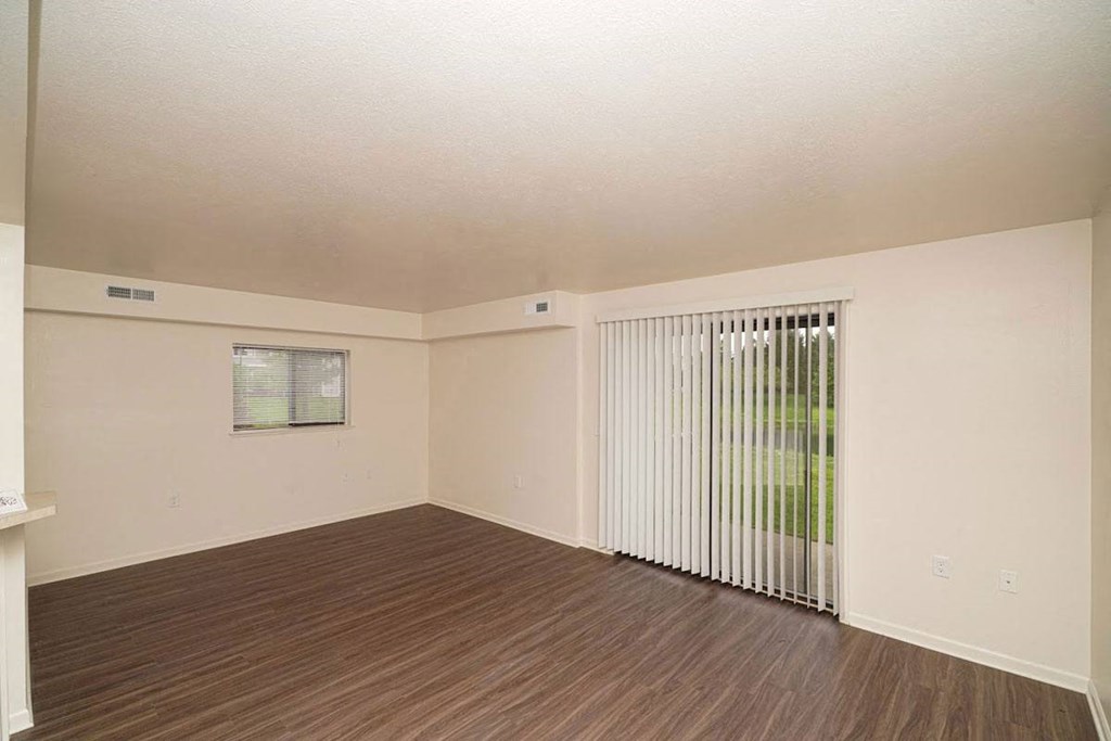 an enlarged living room with a sliding glass door  at Arbor Lakes Apartments, Elkhart, IN, 46516