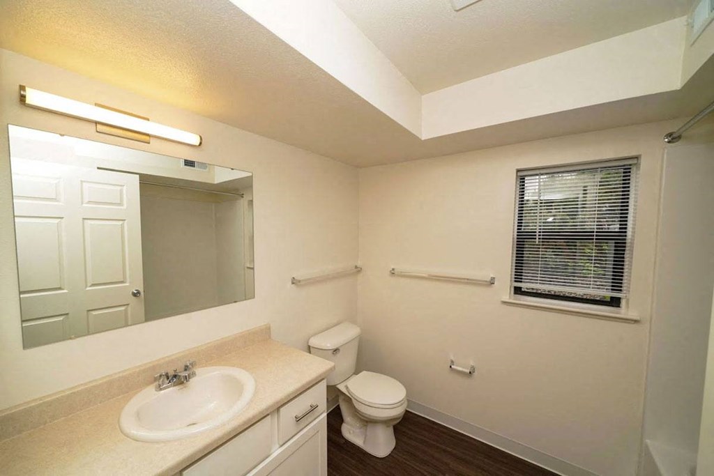 a renovated bathroom with a window  at Arbor Lakes Apartments, Elkhart, IN, 46516