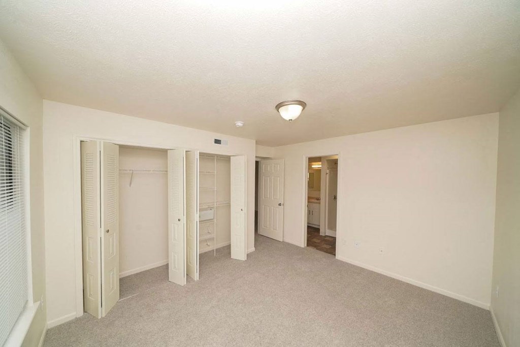 bedroom with a walk-in closet with wardrobe organizers  at Arbor Lakes Apartments, Elkhart, IN, 46516