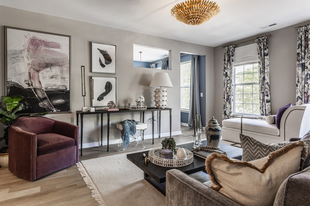 a living room with couches and chairs and a table  at Alexandria of Carmel Apartments, Carmel, IN, 46032