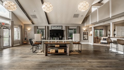 A modern living room with a wooden floor and a fireplace