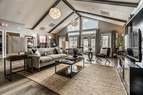 A modern living room with a large couch and a coffee table.