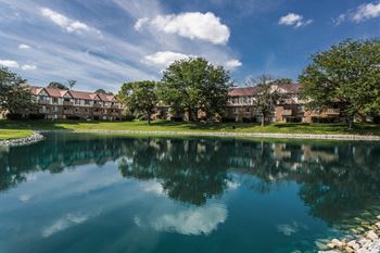 A serene lake in front of a residential area at Autumn Woods Apartments, Miamisburg, 45342