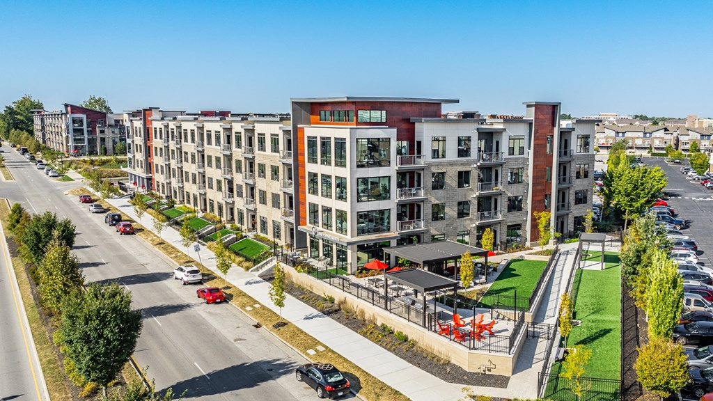 an aerial view of a row of apartment buildings on a city street at Avant & Avant II, Carmel, IN, 46032