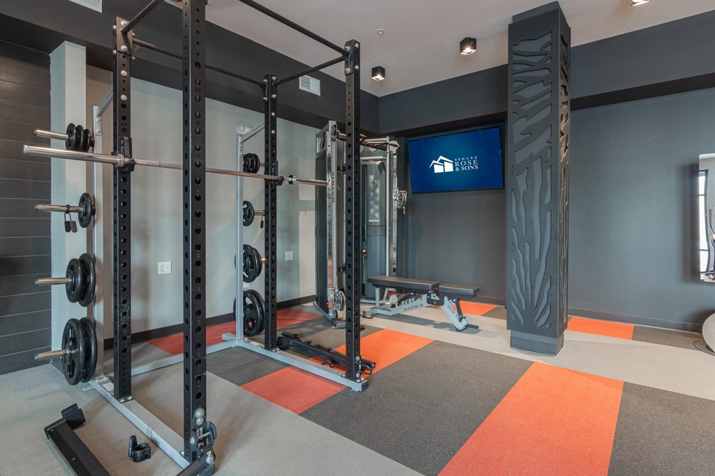 Fitness center with weights machines and a tv in Carmel, IN, 46032