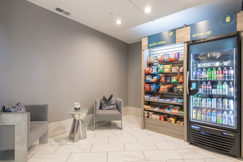 Club market with vending machines and chairs in Avant Apartments clubhouse Carmel, 46032