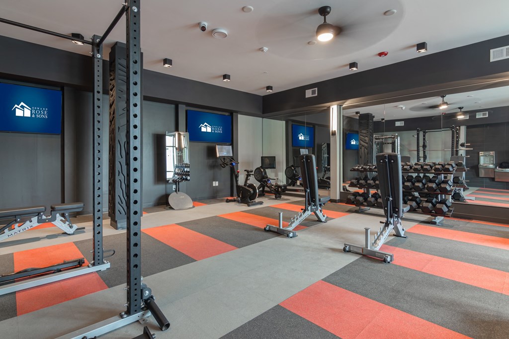 a fitness room with weights and exercise equipment at Avant Apartments in Carmel, 46032