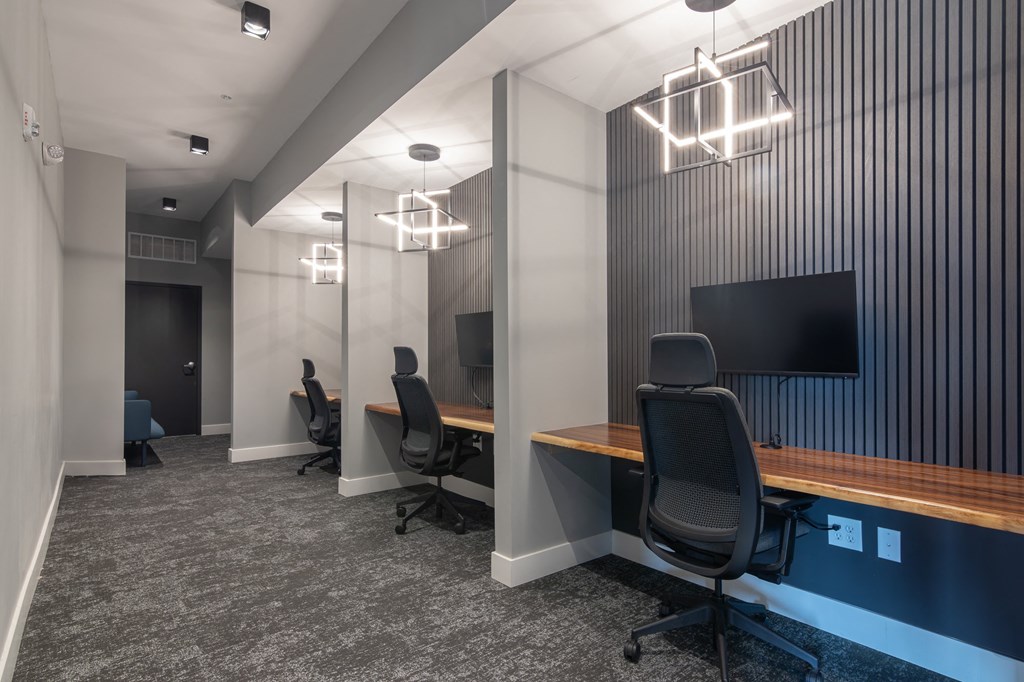 remote work spaces with chairs and TVs in Carmel, IN