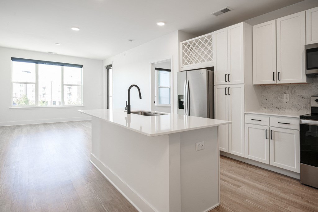 a large white kitchen with white cabinets and a white counter top at Avant & Avant II, Carmel, IN, 46032