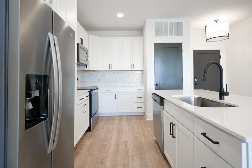 a kitchen with white cabinets and stainless steel appliances at Avant & Avant II, Carmel, IN, 46032