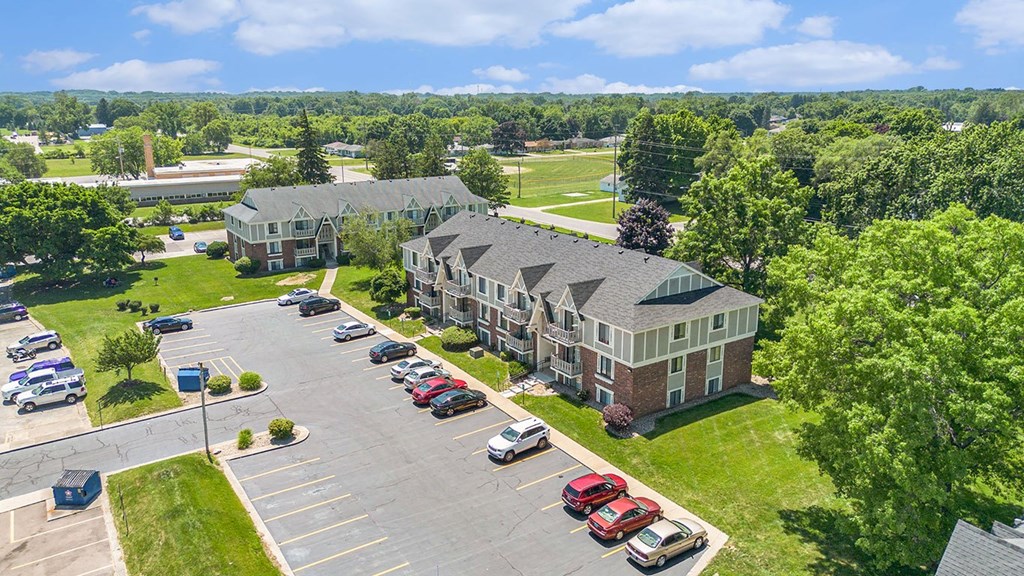 an aerial view with shade trees and green lawns at Briarwood Apartments, Benton Harbor, Michigan