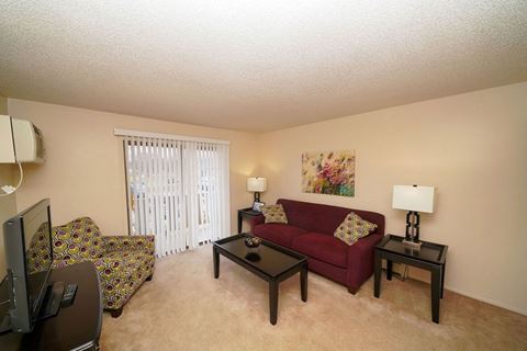 Living Area with Private Balcony at Apple Ridge Apartments, Walker, MI