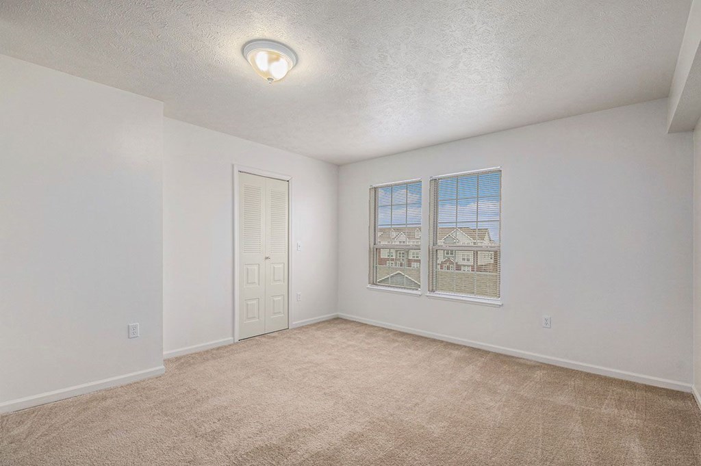 Spacious bedroom with large windows  at Black Sand Apartment Homes, Lincoln, NE