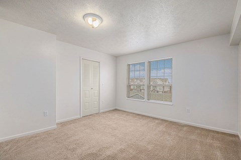 Spacious bedroom with large windows  at Black Sand Apartment Homes, Lincoln, NE