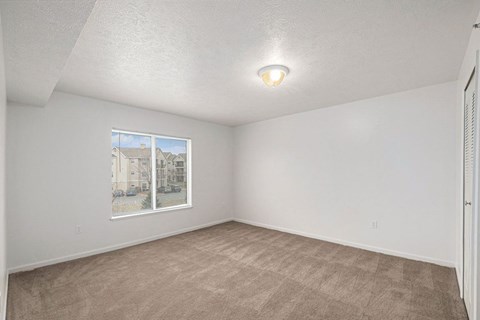 spacious bedroom with a large window  at Black Sand Apartment Homes, Lincoln, NE