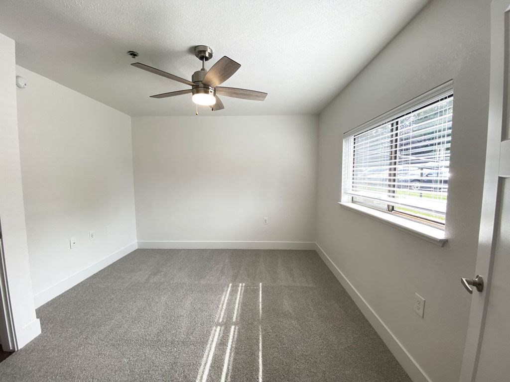 Spacious Bedroom with Ceiling Fan at Byron Lakes Apartments in Byron Center, MI