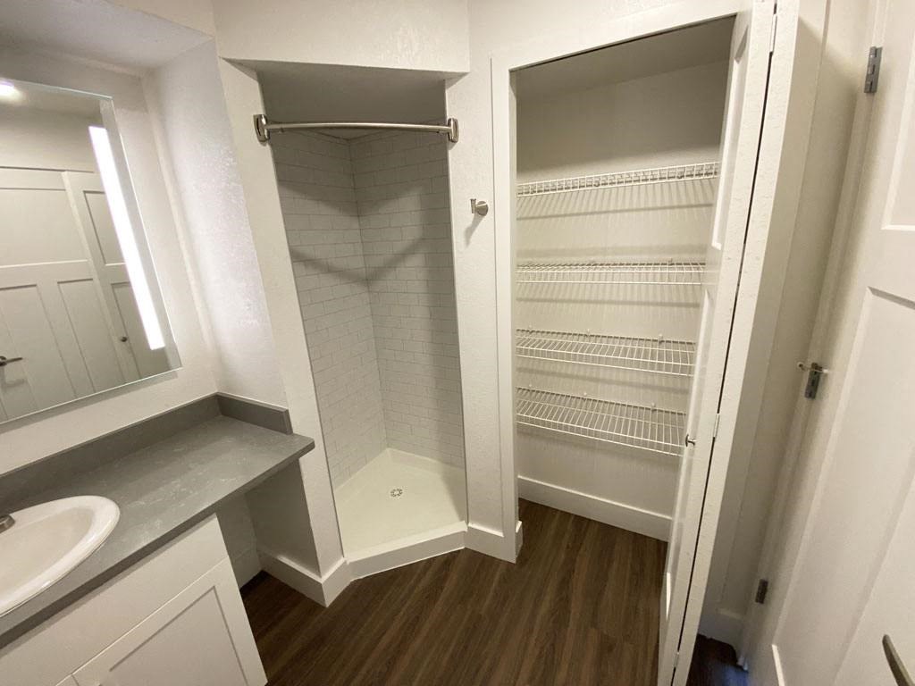 Second Bath with Linen Closet at Byron Lakes Apartments in Byron Center, MI