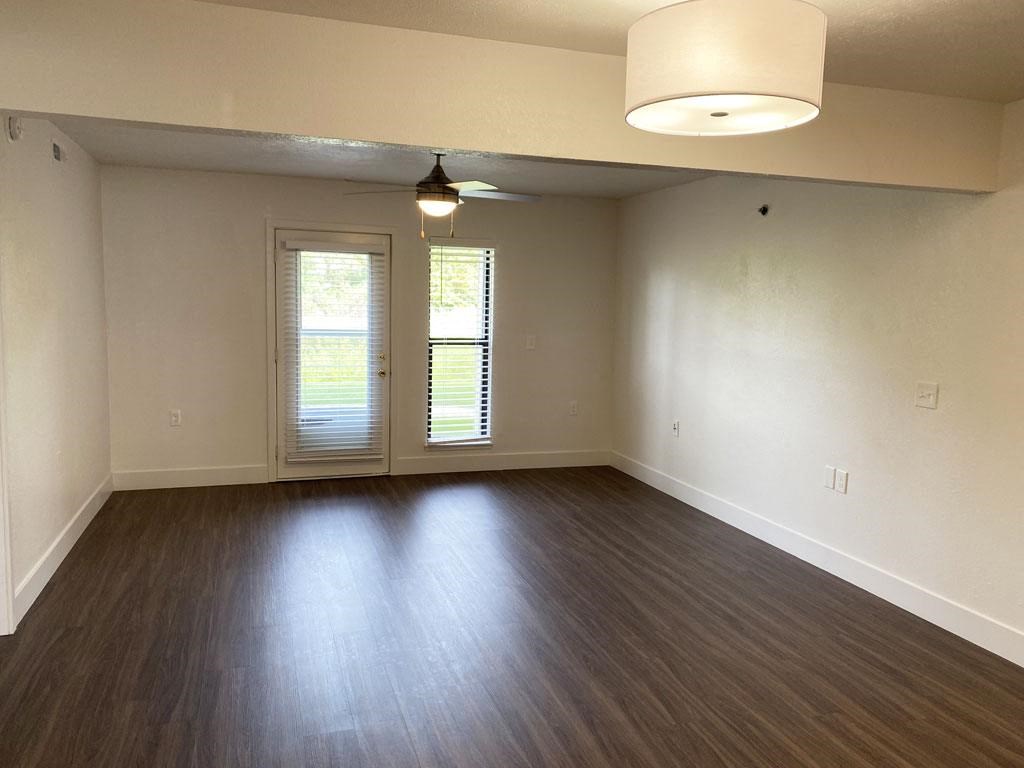 Living Room with Hard-Surface Flooring at Byron Lakes Apartments in Byron Center, MI