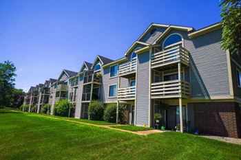 Private Patio or Balcony with Storage at Pine Knoll Apartments in Battle Creek, MI