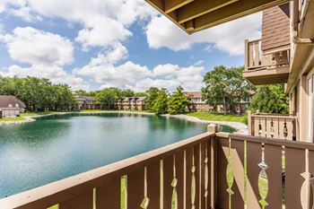A view from a balcony overlooking a lake